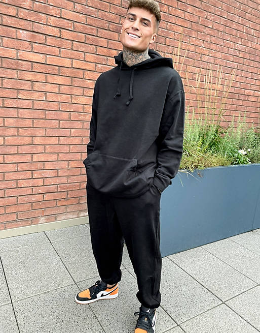 Men oversized tracksuit with large back print in black 