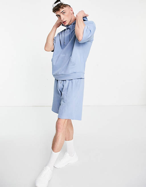 Men oversized tracksuit with short sleeve hoodie and shorts in washed blue 