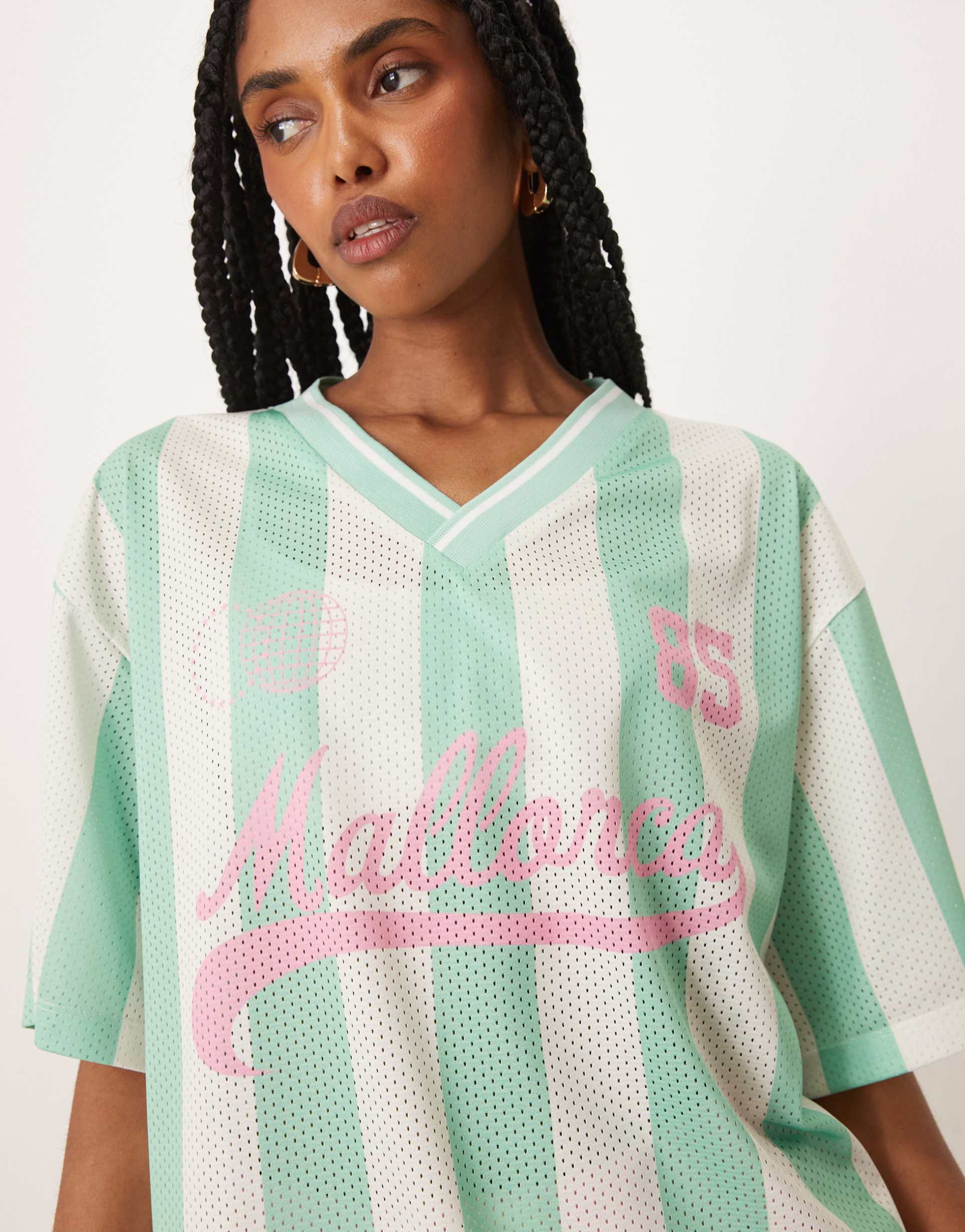 asos design oversized v neck soccer t-shirt with mallorca graphic in green stripes