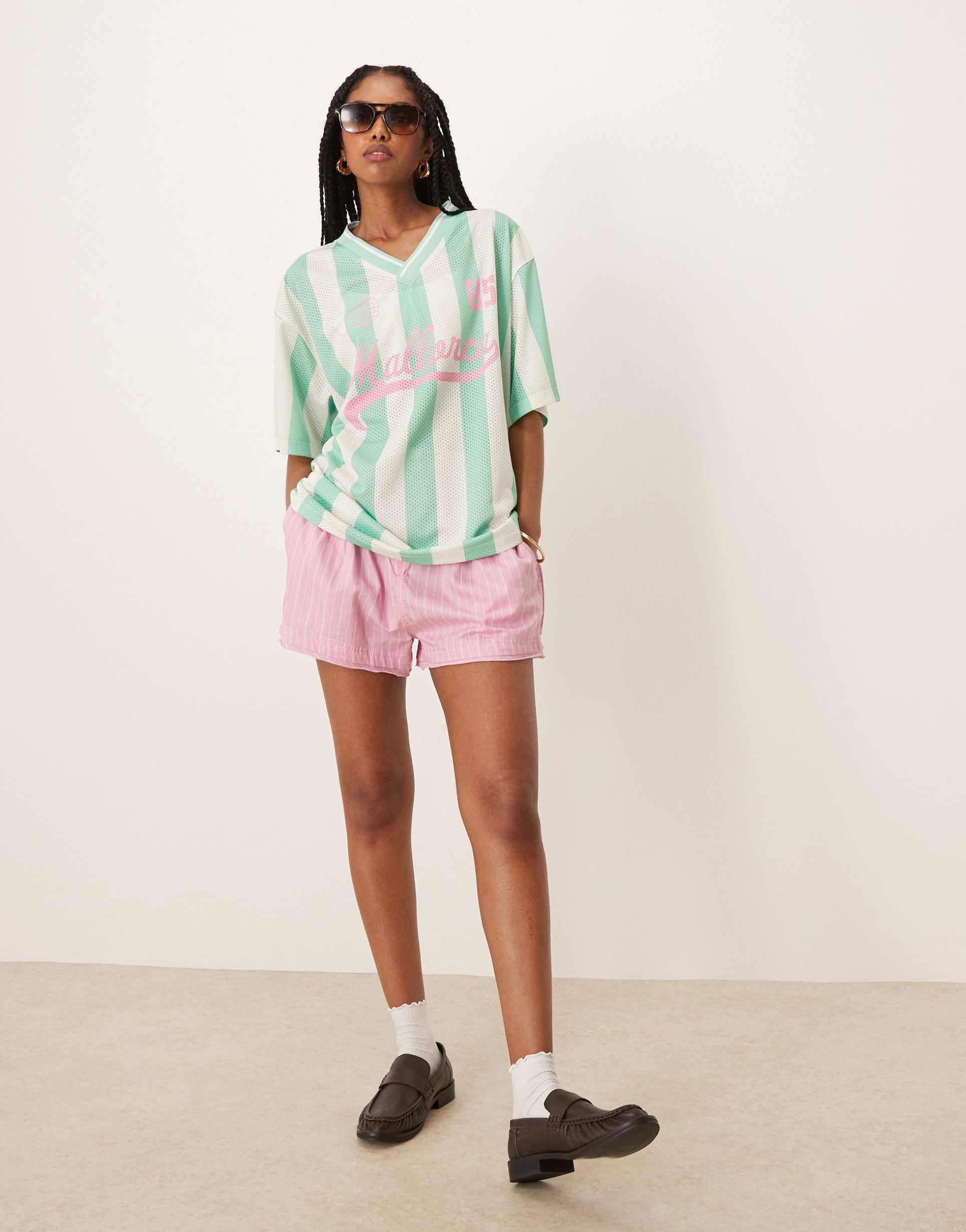 asos design oversized v neck soccer t-shirt with mallorca graphic in green stripes