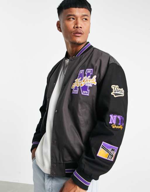 ASOS DESIGN oversized varsity bomber jacket in black with purple badging