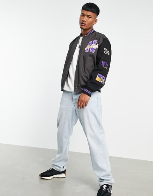 ASOS DESIGN oversized varsity bomber jacket in black with purple badging