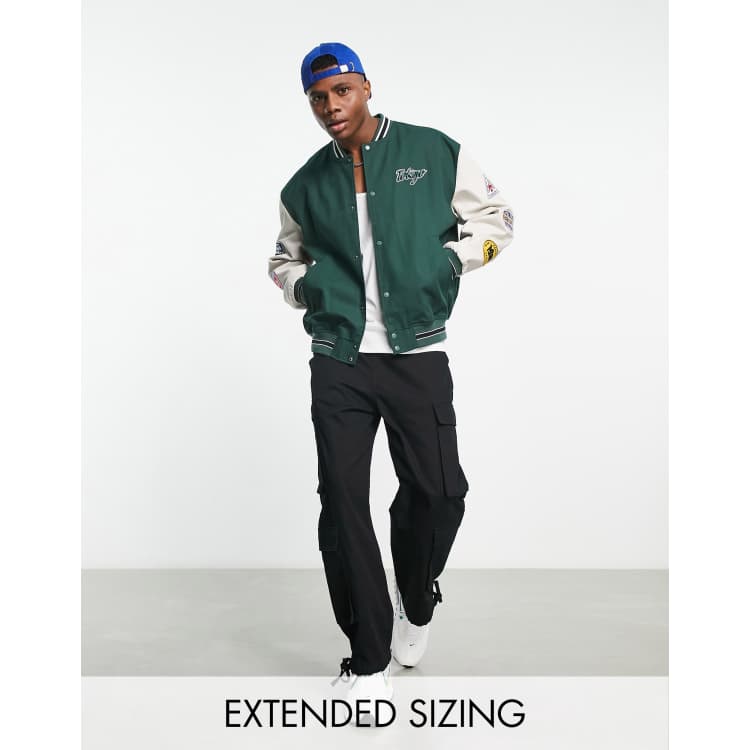 ASOS DESIGN oversized varsity bomber jacket in green