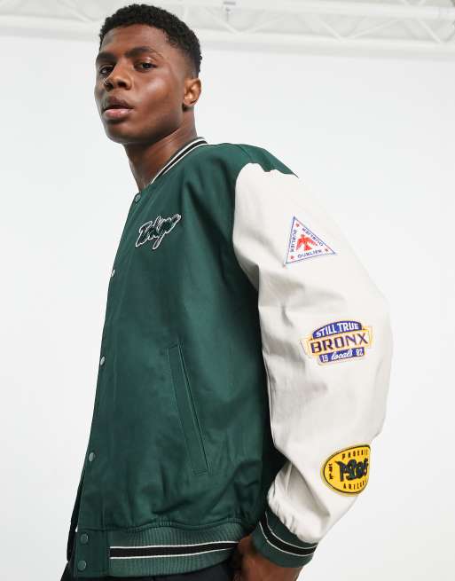 ASOS DESIGN oversized varsity bomber jacket in green and ecru cotton