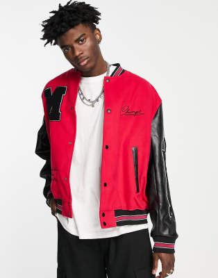 ASOS DESIGN varsity jacket in black with faux leather sleeves