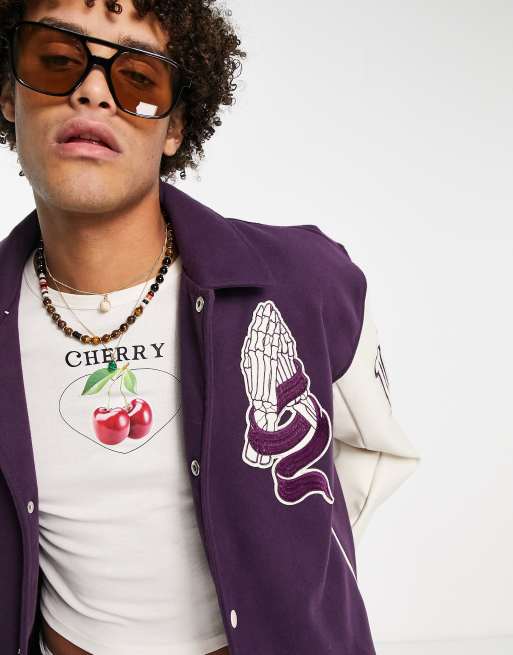 ASOS Design Oversized Varsity Jacket with Badges in Blue