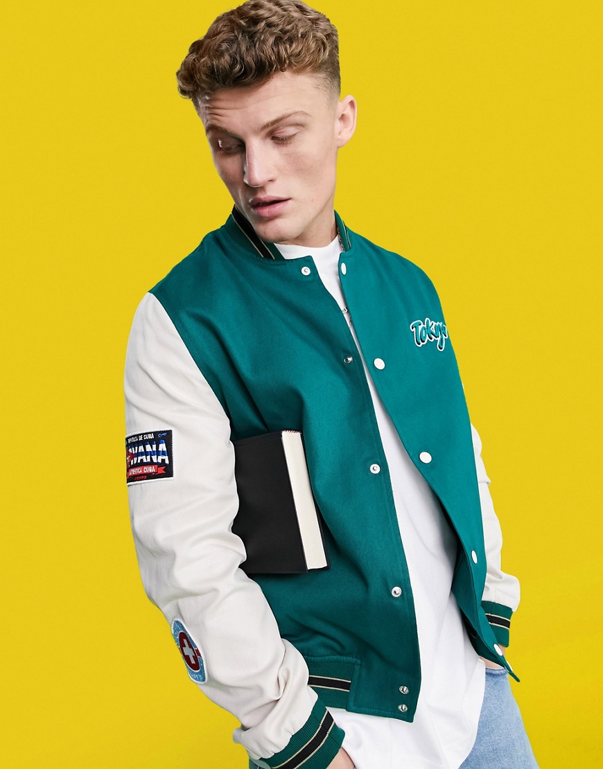 ASOS DESIGN oversized varsity cotton bomber jacket in green with embroidered badging