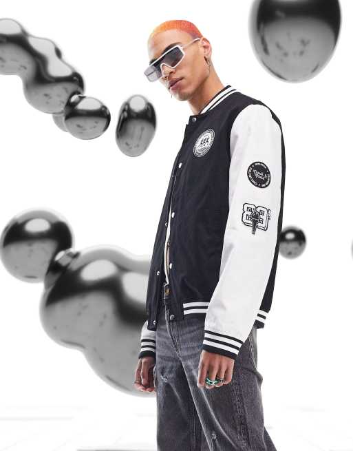 ASOS DESIGN oversized varsity jacket with badges in blue