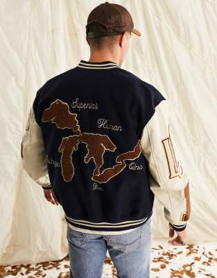 ASOS DESIGN oversized varsity jacket in navy | ASOS
