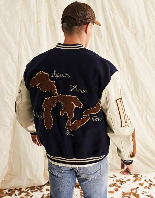 ASOS DESIGN oversized varsity jacket in navy