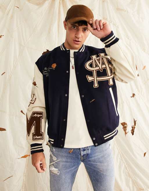 ASOS Design Oversized Varsity Jacket with Badges in Blue