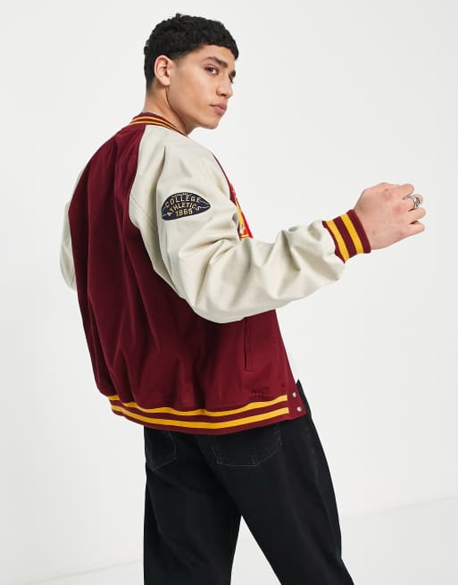 ASOS Design Oversized Varsity Jacket with Badges in Blue