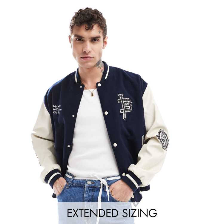 ASOS DESIGN oversized varsity jacket with faux leather sleeves in 