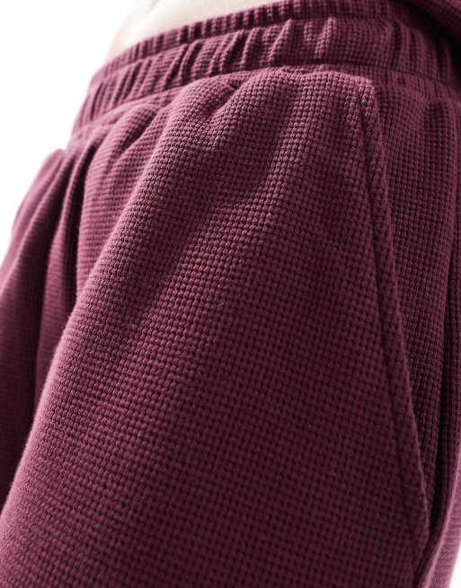 ASOS DESIGN oversized waffle pants in burgundy - part of a set