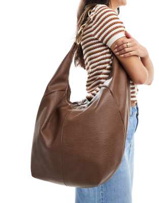 ASOS DESIGN oversized washed tote bag with hardware detail in tan-Brown