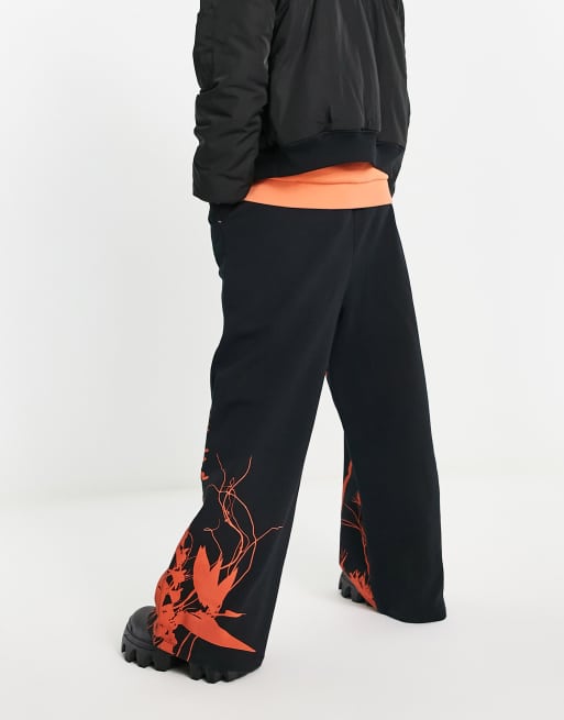 ASOS DESIGN oversized wide leg joggers in black with photographic print