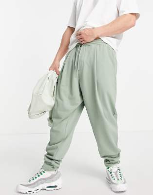 ASOS DESIGN oversized wide leg sweatpants with pressed pleat in green - MGREEN - part of a set