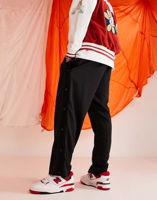 ASOS DESIGN oversized wide leg sweatpants with snaps in black