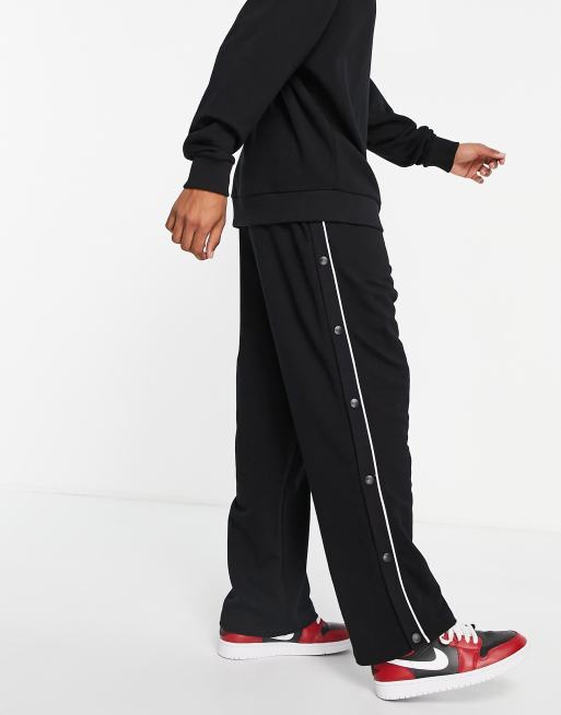 ASOS DESIGN oversized wide leg trackies with poppers and piping in black (part of a set)