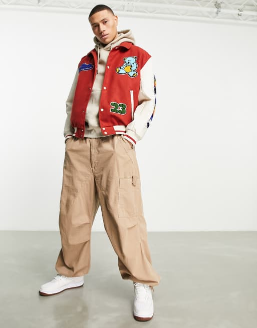 ASOS DESIGN oversized varsity jacket in red with badging and contrast  sleeves