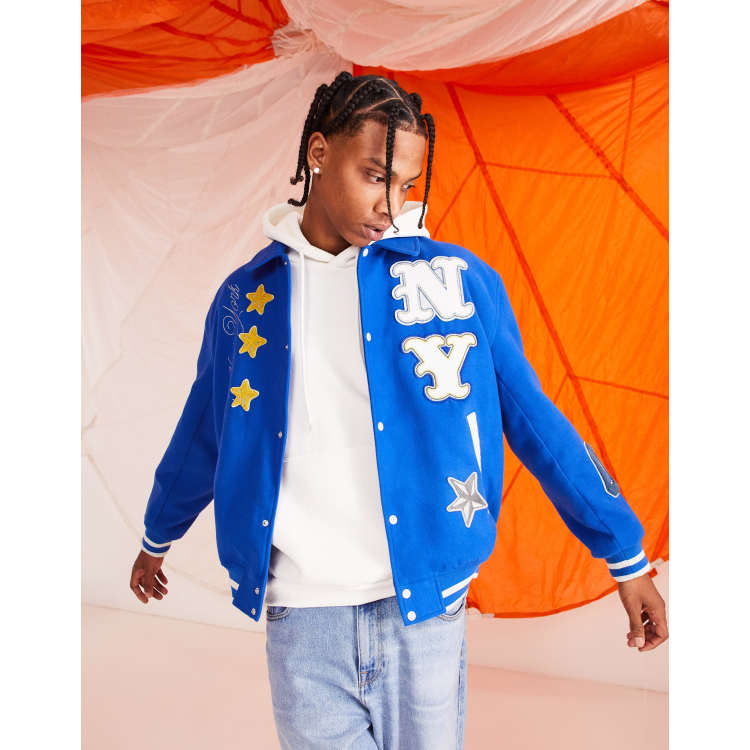 ASOS Design Oversized Varsity Jacket with Badges in Blue