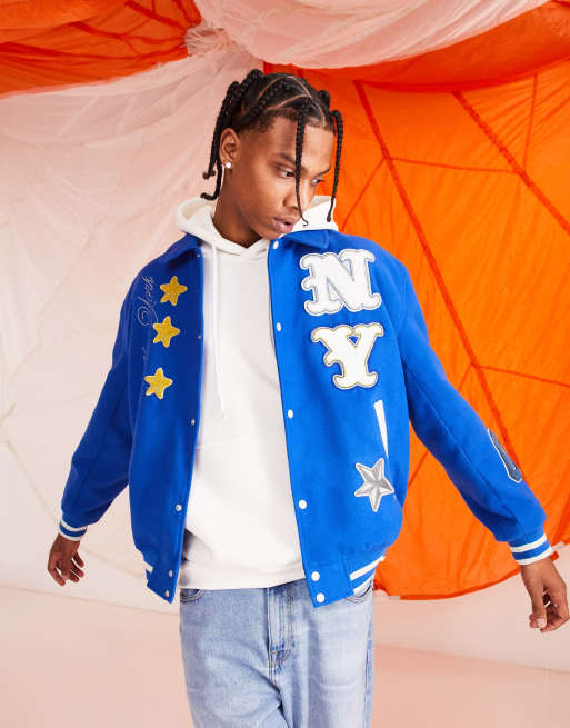 ASOS Design Oversized Varsity Jacket with Badges in Blue