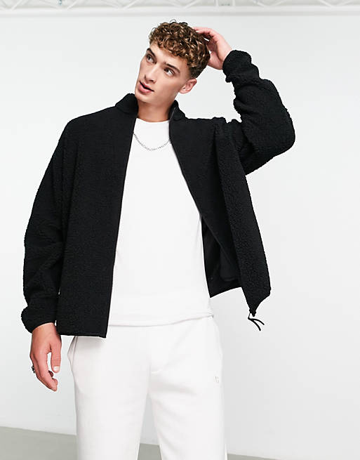 ASOS DESIGN oversized zip through track jacket in black borg | ASOS