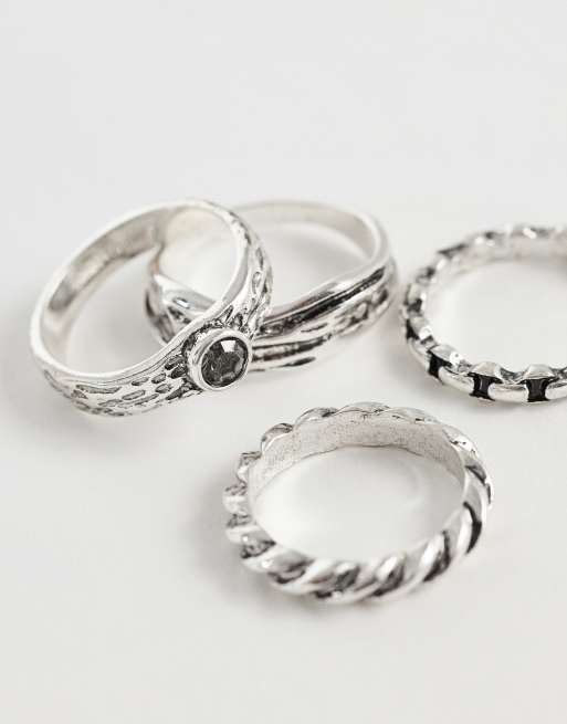 ASOS DESIGN - Pack de 4 anillos plateados pulidos con diseño de cadena y cruzado, 2 de 3