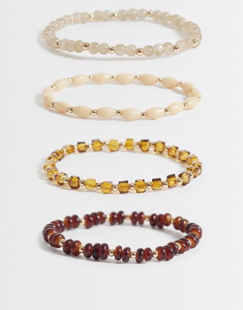 ASOS DESIGN - Pack de 4 pulseras en tonos ámbar con cuentas variadas - view 1