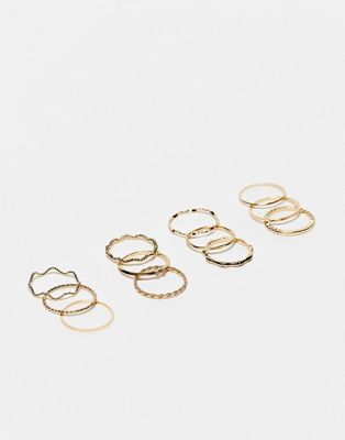 ASOS DESIGN pack of 12 rings with twist details and engraved designs in gold tone