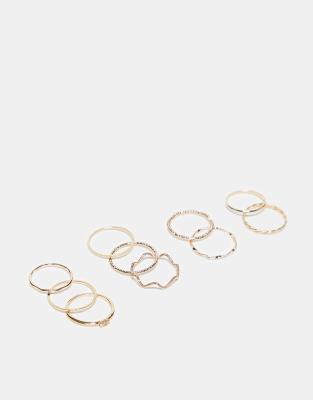 ASOS DESIGN pack of 12 rings with twist details and engraved designs in gold tone