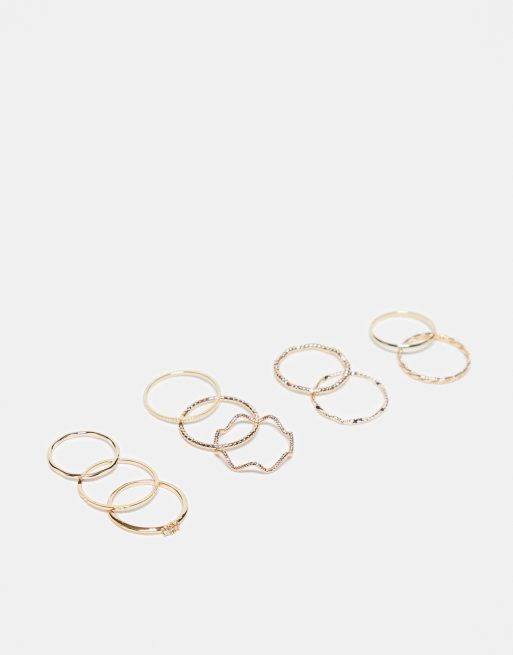  ASOS DESIGN pack of 12 rings with twist details and engraved designs in gold tone