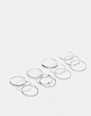 ASOS DESIGN pack of 12 rings with twist details and engraved designs in silver tone