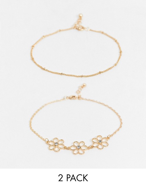 ASOS DESIGN pack of 2 anklets with cut out daisy charms in gold tone