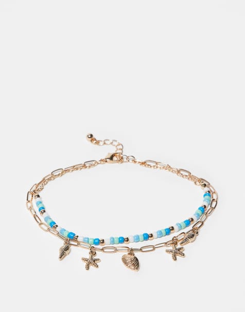 ASOS DESIGN pack of 2 anklets with seashell charms and beaded design in gold tone - view 1