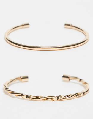 ASOS DESIGN pack of 2 cuff bracelets with plain and twist detailing in gold tone