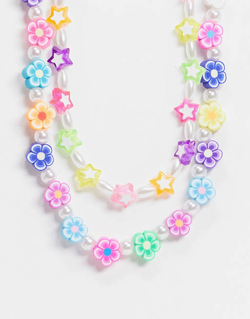 ASOS DESIGN pack of 2 necklaces with star flower and pearl bead
