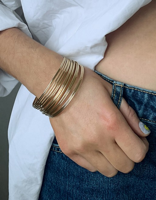 ASOS DESIGN pack of 20 fine bangle bracelets in gold tone