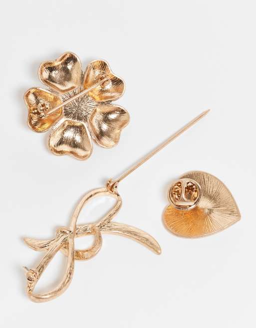 ASOS DESIGN pack of 3 brooches with flower, bow and heart design in worn gold tone