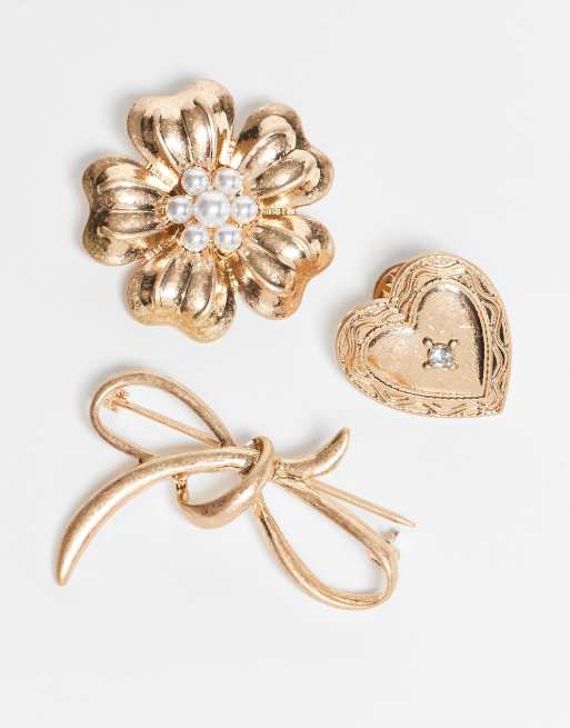 ASOS DESIGN pack of 3 brooches with flower, bow and heart design in worn gold tone