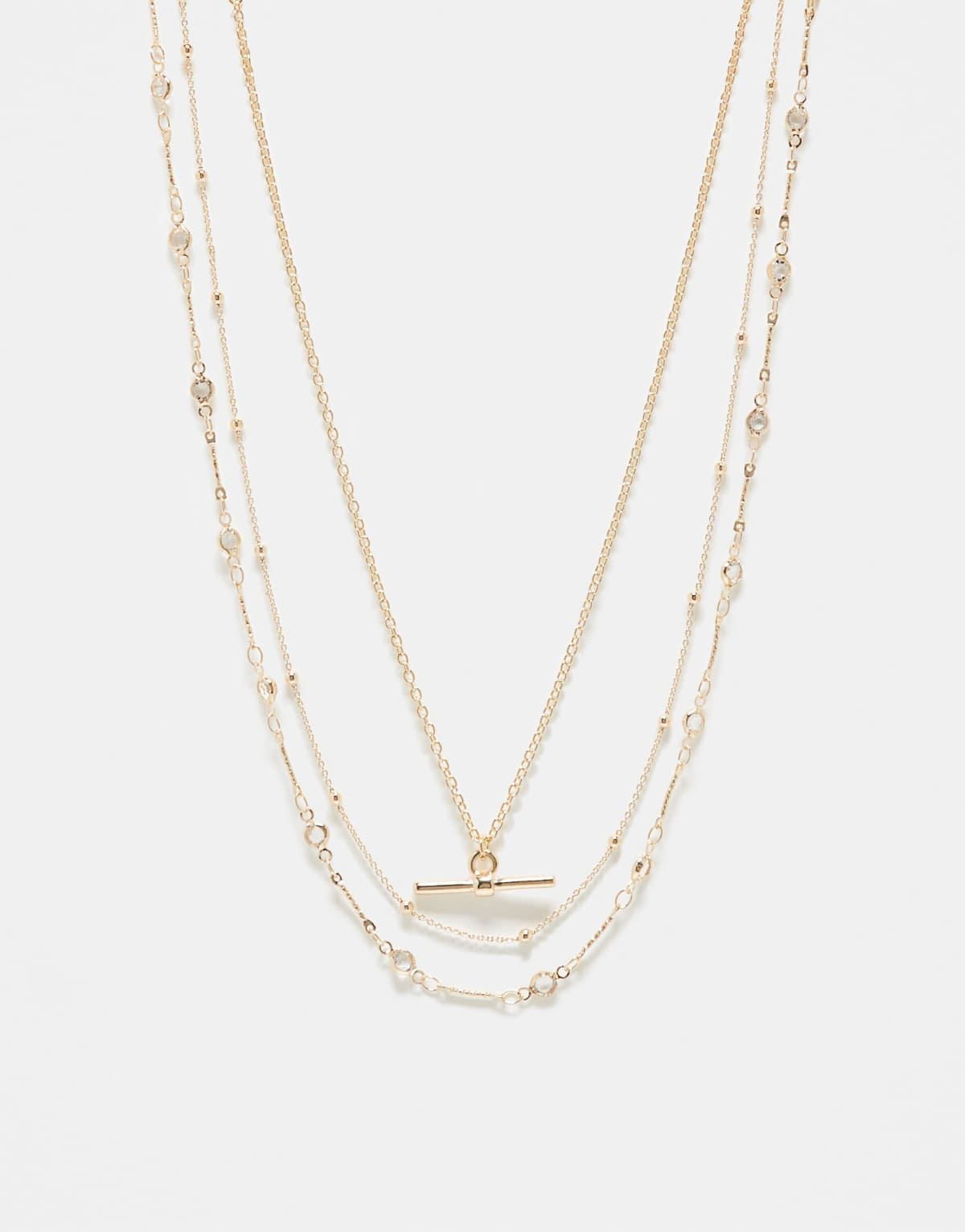 ASOS DESIGN pack of 3 necklaces with T-bar and star detail in gold tone