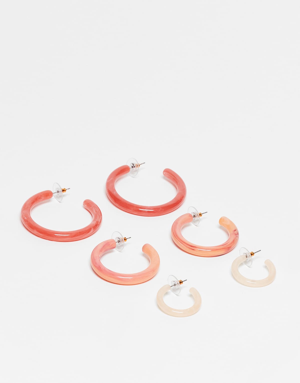 ASOS DESIGN pack of 3 resin hoops in graduating sizes in peachy pink tones