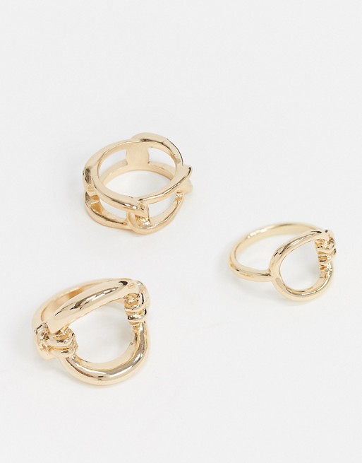ASOS DESIGN pack of 3 rings in mixed link and knot designs in gold tone