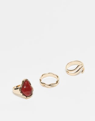 pack of 3 rings with semi precious style red stone in gold tone