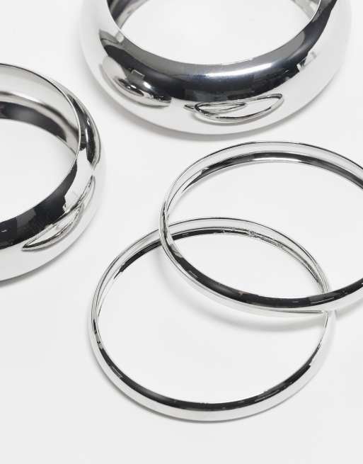 ASOS DESIGN pack of 4 bangle bracelets in mixed design in silver