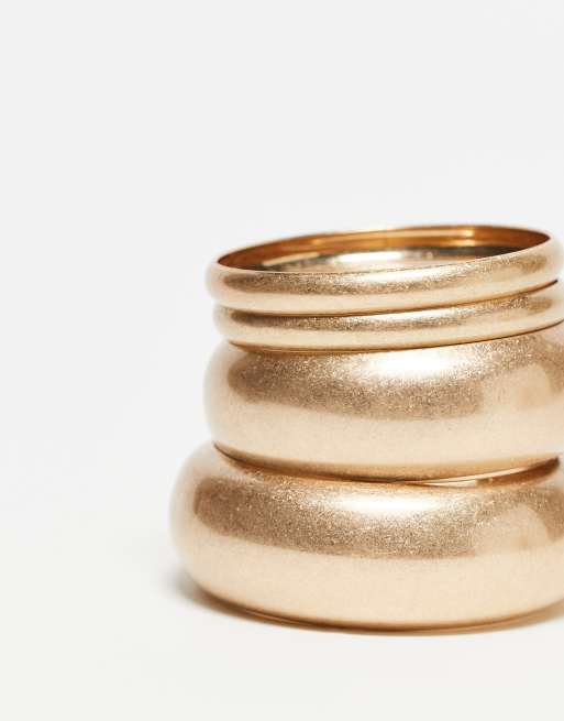 ASOS DESIGN pack of 4 bangles in brushed gold tone