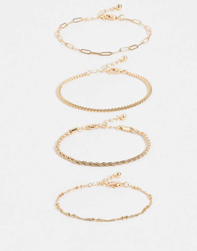 ASOS DESIGN pack of 4 fine chain bracelets in gold tone