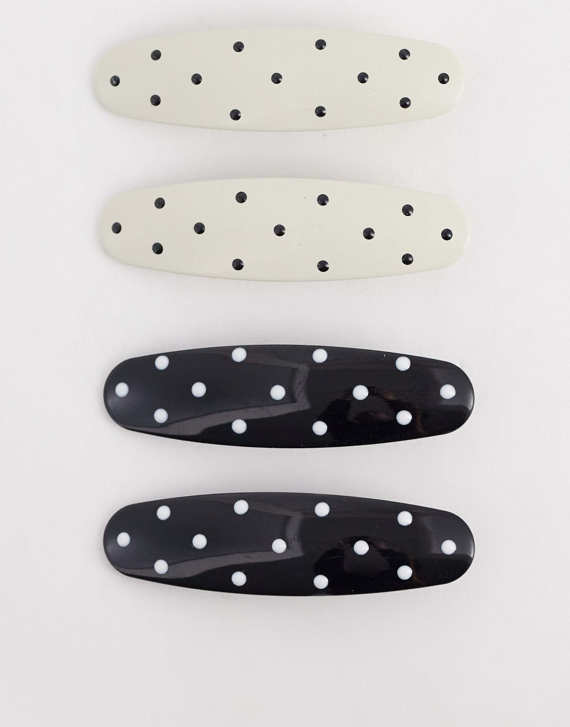 asos design pack of 4 hair clips with polka-dot design in black and white