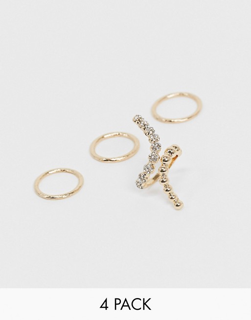 ASOS DESIGN pack of 4 rings with statement swirl in gold tone