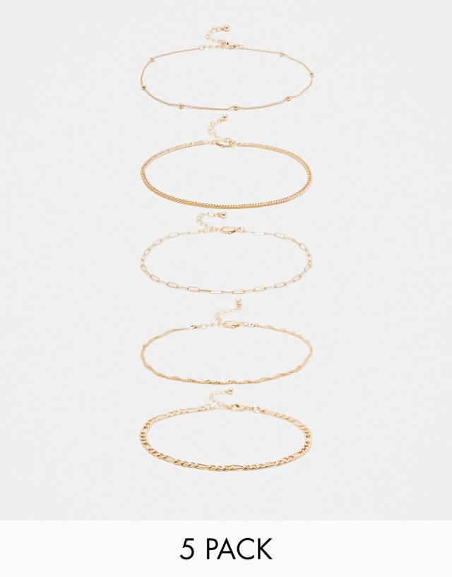 ASOS DESIGN pack of 5 anklets with mixed design in gold tone